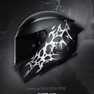 May include: A black motorcycle helmet with a carbon fiber weave pattern and a white tribal design on the side. The helmet has a dark visor and the text "DISTINCT" is visible.