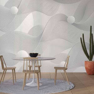 May include: A contemporary dining area with a circular white table and wooden chairs. A black bowl sits on the table. A tall cactus in a terracotta pot is positioned to the side. The wall features a textured, abstract design in white and grey.