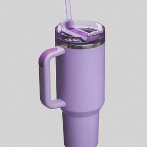 May include: A lavender insulated tumbler with a handle and a clear lid. The tumbler has a matching lavender handle and a clear straw. The lid has a sliding closure to prevent spills. The tumbler is designed to keep drinks cold or hot.