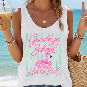 May include: White tank top with the text "Goodbye School Hello Pool" in pink script, featuring a pink flamingo floatie design. The background has vertical mint green stripes. The image is taken outdoors on a sunny day.