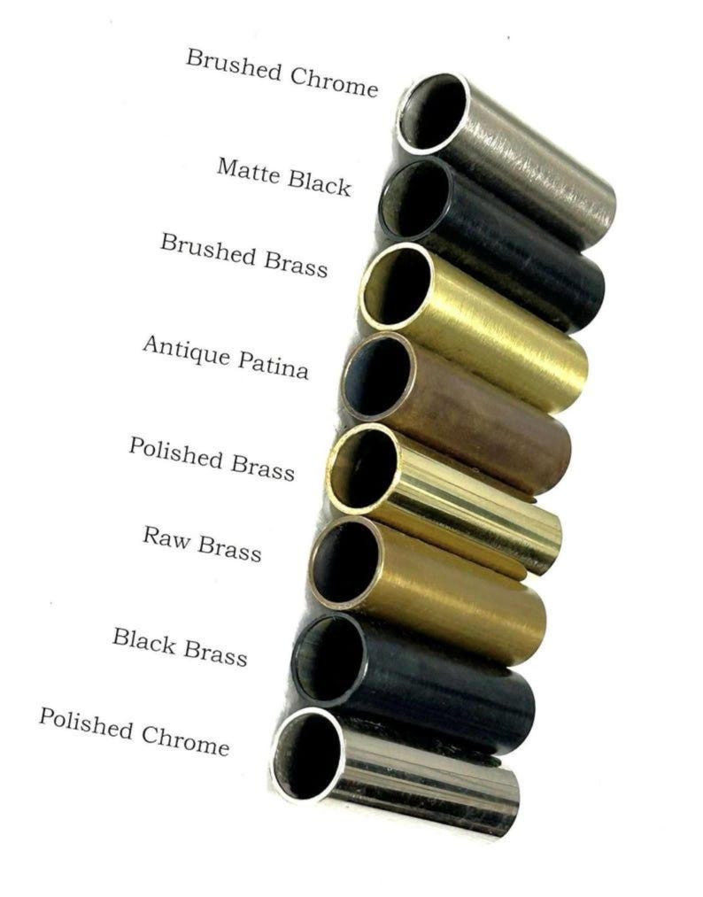 May include: A collection of metal tubes in various finishes, including Brushed Chrome, Matte Black, Brushed Brass, Antique Patina, Polished Brass, Raw Brass, Black Brass, and Polished Chrome. The text labels each finish. The tubes are cylindrical and have an open end.