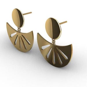May include: A pair of gold-coloured earrings. Each earring has a circular stud connected to a fan-shaped pendant with cut-out lines. The earrings are displayed on a white background.