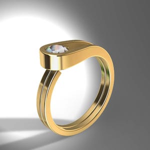 May include: A gold ring featuring a double band design that converges into a single, flat, elongated top section. A single, round, clear, faceted gemstone is set flush into the center of this smooth, polished gold surface, creating a sleek look.