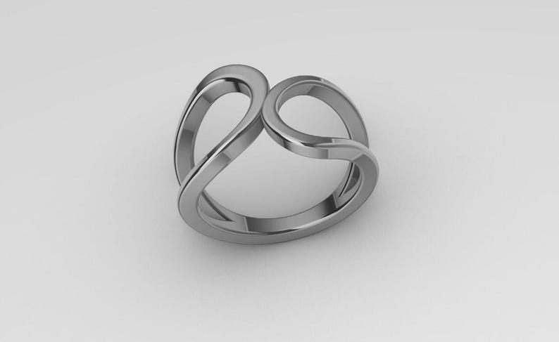 May include: A polished silver-toned metal ring featuring a continuous, fluid design with two open, overlapping loops that create a symmetrical, interconnected shape. The band has a smooth, reflective surface and a rounded profile throughout its structure.