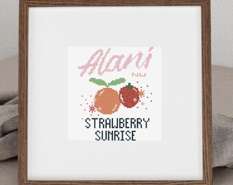 May include: A framed cross-stitch artwork featuring a strawberry and orange design with the text "Alani" in pink script above and "STRAWBERRY SUNRISE" below. The artwork is in a brown wooden frame.