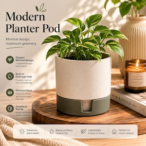 May include: A modern planter pod with a light beige upper section and a dark green base, holding a vibrant green plant with yellow-green leaves. The text "Modern Planter Pod" is at the top.