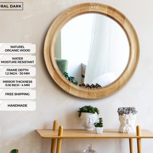 May include: A round wooden mirror with a natural finish. The frame depth is 1.2 inches (30 mm), and the mirror thickness is 0.16 inches (4 mm). The mirror is labeled "Natural Dark" and "Handmade".