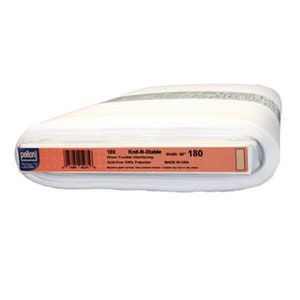 May include: A roll of white Knit-N-Stable interfacing fabric. The label reads "180" and "width 60 in". The fabric is acid-free and made of 100% polyester. The brand name "pellon" is visible on the label.