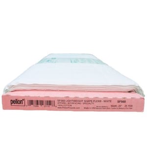 May include: A package of white Pellon SF568 Lightweight Shape Flex interfacing fabric. The pink box displays product information, including the width of 20 inches and the text "100% Cotton". The fabric is folded neatly.