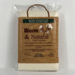 May include: A package of Warm & Natural needle-punched cotton batting. The brown paper packaging features the brand name, cotton plant illustrations, and product details. The batting measures 45 x 60 inches.