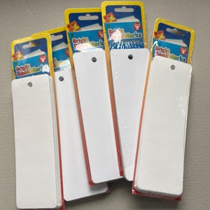 May include: Five packs of white blank bookmarks with a hole punched at the top. Each pack has a yellow and red header with the text "Bright Bookmarks" printed on it.