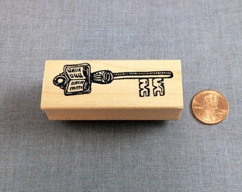 Key and Book Rubber Stamp