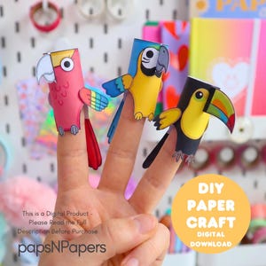 May include: Three paper finger puppets shaped like birds, including a pink parrot, a yellow and blue macaw, and a black toucan with a colorful beak. The text reads: This is a Digital Product - Please Read the Full Description Before Purchase.