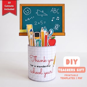 May include: A cylindrical pencil holder with a grid pattern, featuring the text "Thank you for a wonderful school year." It contains paper cutouts of school supplies including a ruler, brushes, pencils, scissors, and an apple, set against a chalkboard.