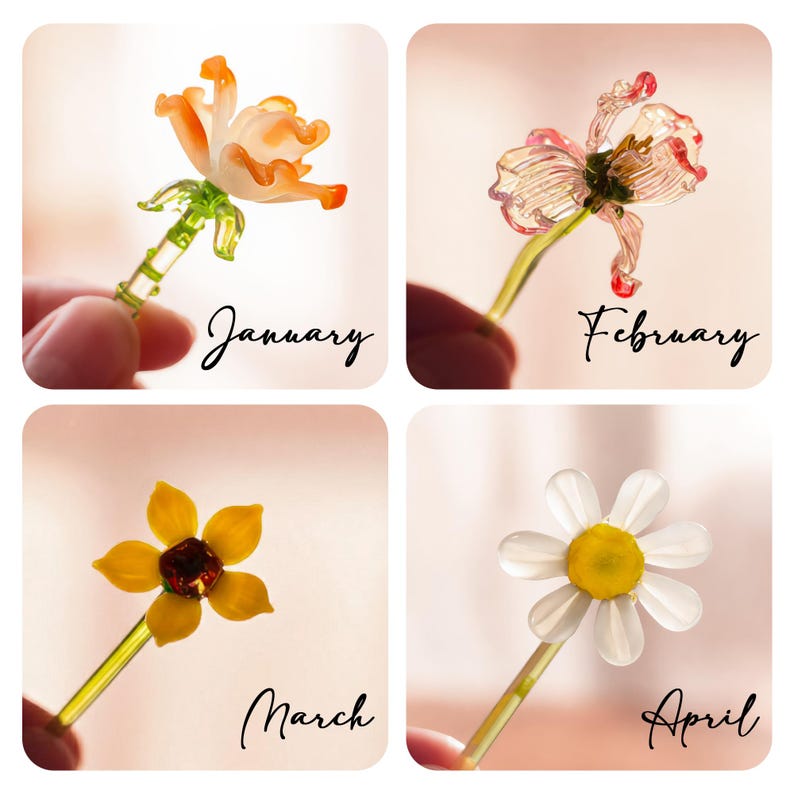 May include: A set of four glass flower figurines on stems, each labeled with a month. January features an orange flower, February a pink-tipped translucent flower, March a yellow flower with a dark center, and April a white daisy-like flower.