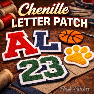 May include: Chenille letter patches in red, blue, and green with white borders, including the letters "A" and "L", the number "23", a basketball, and a paw print. The patches are displayed on a wooden surface.