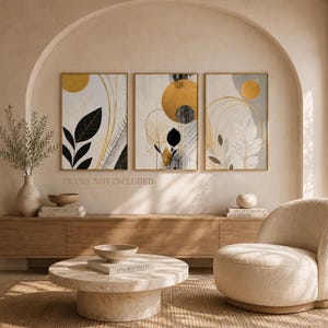 Könnte beinhalten: Ein Set aus drei rechteckigen Wandkunstdrucken mit abstrakten botanischen und geometrischen Mustern in Gold, Schwarz und Weiß. Die Kunstwerke zeigen Kreise, feine Linien und Blattmotive. Der Text "FRAME NOT INCLUDED" ist unter den Drucken zu sehen.