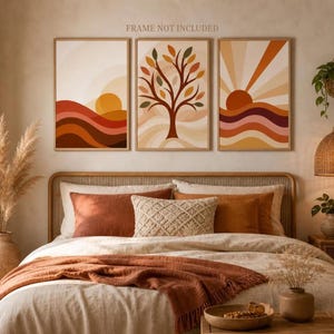 Könnte beinhalten: Ein Set aus drei rechteckigen Wandbildern mit abstrakten Motiven: eine Sonne über Hügeln, ein Baum mit bunten Blättern und eine strahlende Sonne über Wellen in warmen Erdtönen. Der Text FRAME NOT INCLUDED ist deutlich zu sehen.