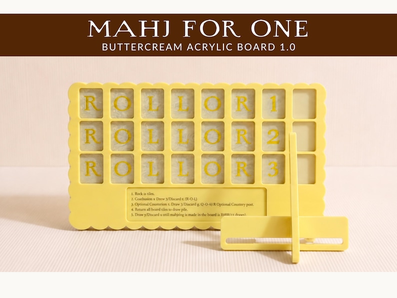 May include: A yellow acrylic board for Mahjong, with the text "MAHJ FOR ONE" and "ROLL OR 1 ROLL OR 2 ROLL OR 3" in yellow. The board has a scalloped edge and a stand. Instructions are printed at the bottom.