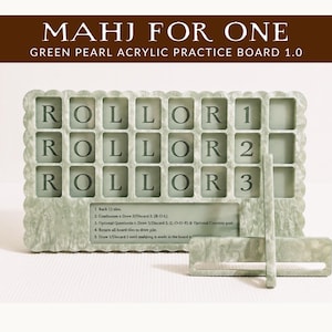 May include: Green pearl acrylic Mahjong practice board with the text "MAHJ FOR ONE" and "ROLLOR1, ROLLOR2, ROLLOR3". The board has a scalloped edge and includes a tile rack and a stand.
