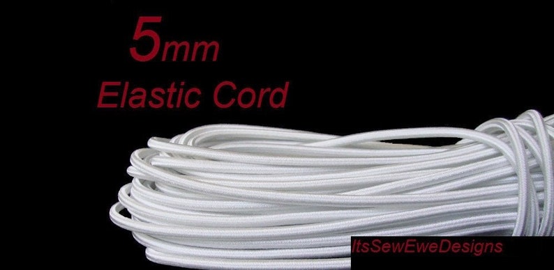 May include: White elastic cord, 5mm thick, wound into a coil. The cord is a soft, flexible material that is perfect for sewing projects.