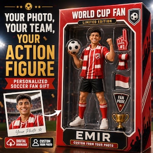 May include: A personalized action figure in a red and black box labeled WORLD CUP FAN and EMIR. The figure wears a red and white striped jersey, black shorts, and red socks, holding a soccer ball. Accessories include a foam finger, scarf, flag, and trophy.