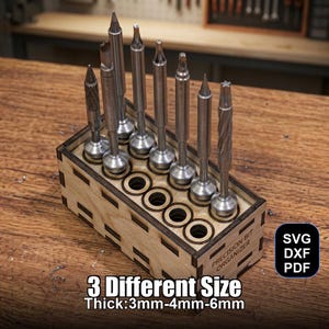 May include: A wooden precision bit organizer holding various metal bits. The organizer has a laser-cut design and text that reads "PRECISION BIT ORGANIZER". The text "3 Different Size Thick:3mm-4mm-6mm" is also visible. The image also includes the text "SVG DXF PDF".