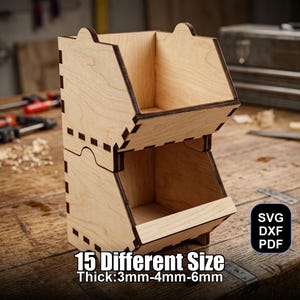 May include: A two-tiered wooden storage bin with a natural finish. The bin features a stacked design with open compartments and decorative cutouts. Text on the image reads "15 Different Size" and "Thick: 3mm-4mm-6mm". The bin is designed for organization.