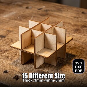 May include: A wooden geometric structure with intersecting planes, creating a grid-like pattern. The object is made of light-colored wood and appears to be a model or a component for a larger project. The text on the image says "15 Different Size Thick:3mm-4mm-6mm".