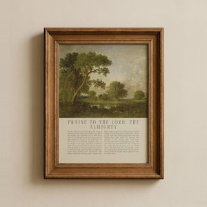 May include: A framed landscape print featuring a pastoral scene with trees and a body of water. The artwork is in a wooden frame and includes the text "PRAISE TO THE LORD, THE ALMIGHTY" at the bottom, with additional text below.