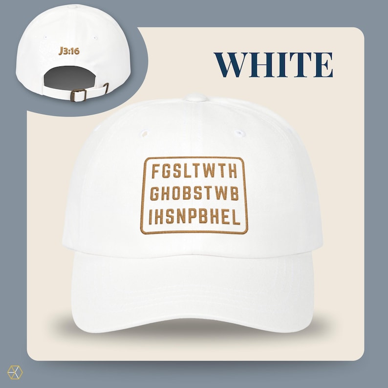 White baseball cap with the text "WHITE" and "J3:16". The front of the cap features a brown rectangular design with the text "FGSLTWTH GHOBSTWBI HSNPBHEL". The cap has an adjustable strap.