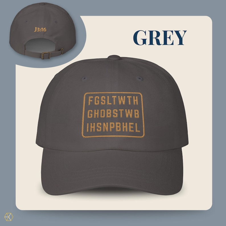 Grey baseball cap with the text "GREY" and "J3:16". The front of the cap features a gold rectangular design with the text "FGSLTWTH GHOBSTWBI HSNPBHEL". The cap has an adjustable strap.