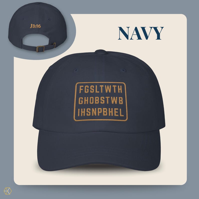 Navy baseball cap with the text "NAVY" and "J3:16". The front of the cap features a gold rectangular design with the text "FGSLTWTH GHOBSTWBI HSNPBHEL". The cap has an adjustable strap.