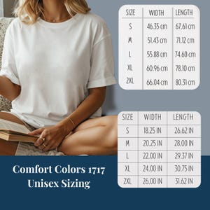 May include: A white Comfort Colors 1717 t-shirt with unisex sizing. The image includes a size chart with measurements in inches and centimeters. The shirt is available in sizes S, M, L, XL,  2XL, 3xl
Literary Gift For Her Book Lover Shirt Comfort Colors Tee Bookish Graphic Design Women Reader Present Dark Academia Style Vintage Owl Linocut Pattern Botanical Frame Detail Stacked Books Graphic Booktok Aesthetic Wear Book Club Gift Reading