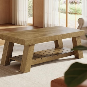 May include: A rectangular wooden coffee table with a natural finish. The table has a slatted shelf and angled legs. The coffee table is approximately 48 inches long, 24 inches wide, and 18 inches high.