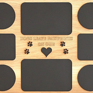May include: Wooden photo frame with a light brown finish and eight openings for pictures. The frame has the text "Dogs leave pawprints on our" with two paw prints on each side of the text and a heart in the centre.