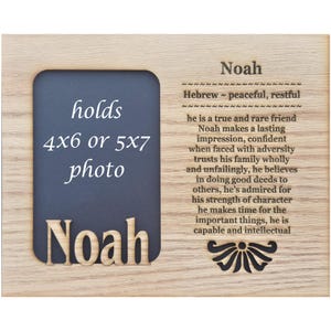 May include: A wooden picture frame with a black and white photo insert. The frame is engraved with the name "Noah" and a definition of the name in Hebrew. The frame can hold a 4x6 or 5x7 photo.