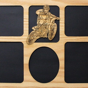 May include: A wooden picture frame with six openings for photos. The frame has a cutout of a motocross rider on a dirt bike in the center.