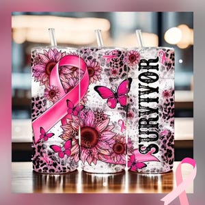 May include: Three pink and white tumblers with a sunflower, butterfly, and ribbon design. The tumblers have the word "SURVIVOR" printed on them. The design includes pink ribbons, butterflies, and sunflowers.