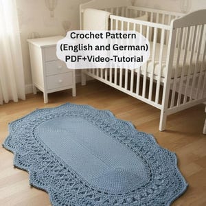 May include: A light blue, oval-shaped crochet rug with a scalloped edge. The rug is placed on a hardwood floor in a nursery setting, near a white crib and a small white cabinet. The text "Crochet Pattern (English and German) PDF+Video-Tutorial" is visible.