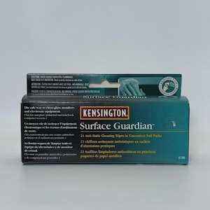 May include: A rectangular box of Kensington Surface Guardian anti-static cleaning wipes. The packaging is dark green and black with white and yellow text. It contains 21 wipes in foil packs for cleaning glass monitors and electronic equipment.