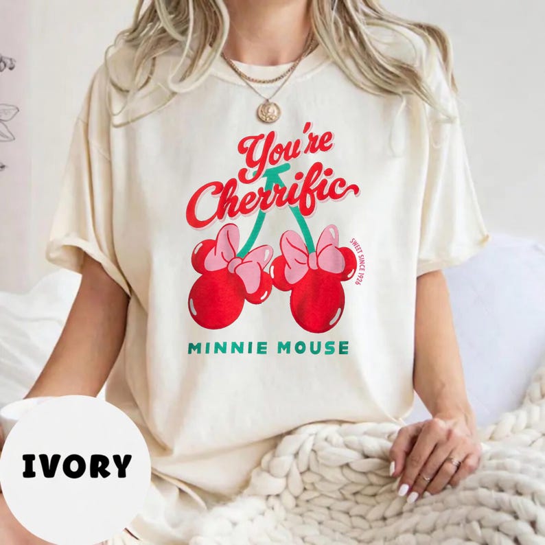 Retro cherry graphic t-shirt featuring a playful fruit design suitable for kids, teens, and adults. Comfortable unisex summer tee perfect for vacations, casual outings, summer activities, and everyday wear. Lightweight and soft fabric with fun, colorful cherry artwork. Ideal for gifting, playful summer wardrobe additions, or matching family outfits. Stylish and versatile graphic shirt for retro-inspired and casual summer fashion.