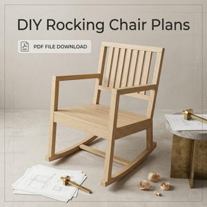 May include: A light-coloured wooden rocking chair with a slatted back and seat. The text "DIY Rocking Chair Plans" and "PDF FILE DOWNLOAD" appear above. A stack of technical drawings with a brass marking gauge sits on the floor nearby.