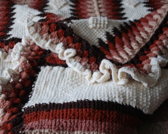 Afghan crochet blanket with trangle pattern.