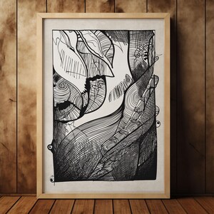 May include: Black and white abstract art print in a light wood frame. The artwork features intricate line drawings of organic shapes, including leaves and swirling patterns. The framed art is displayed on a wooden surface.