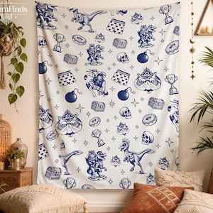 May include: A white wall tapestry featuring a repeating blue ink-style pattern of dinosaurs, skulls, treasure chests, trophies, donuts, bombs, and patterned boxers. The design includes small star accents scattered throughout the fabric surface.