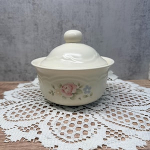 May include: A set of three ceramic nesting bowls in shades of blue, green, and white. The bowls feature a speckled glaze and a simple, modern design. The largest bowl measures approximately 6 inches in diameter.