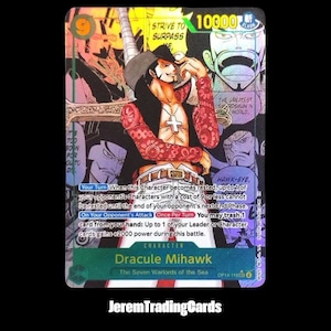 May include: A trading card featuring Dracule Mihawk from "The Seven Warlords of the Sea." The card has a green and black background with the character in the center. Text includes "STRIVE TO SURPASS ME" and "HAWK-EYE."