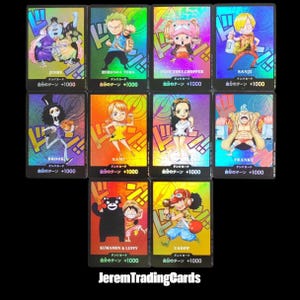 May include: A collection of holographic trading cards featuring various anime characters. Each card has a unique character illustration, Japanese text, and a numerical value. The cards are displayed against a black background.