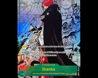 Puede incluir: Una carta coleccionable de One Piece que muestra al personaje Shanks con cabello rojo y una capa negra. La carta tiene un nivel de poder de 12000, un coste de 10 e incluye texto que detalla las habilidades Rush y On Play sobre un fondo manga.